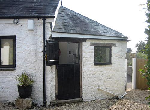 The kitchen with the stable door half open