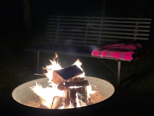 Sit by the fire pit in the evening