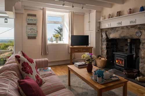 The lounge again, with woodburner lit, very cosy