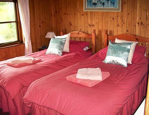 Bedroom 1 with bed split to make two full size singles