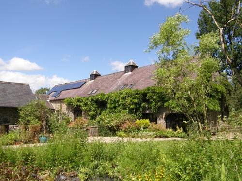View of the house and coach house cottage from the cottage garden