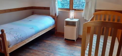 Second bedroom with a single bed plus full size cot