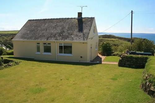 Set in its own garden, with sea views