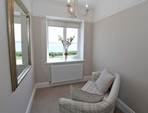 On the second floor is a small sitting area.