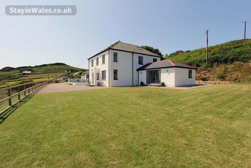 Llwynfor is detached and stands in its own large garden, offering peace and quiet for large group se