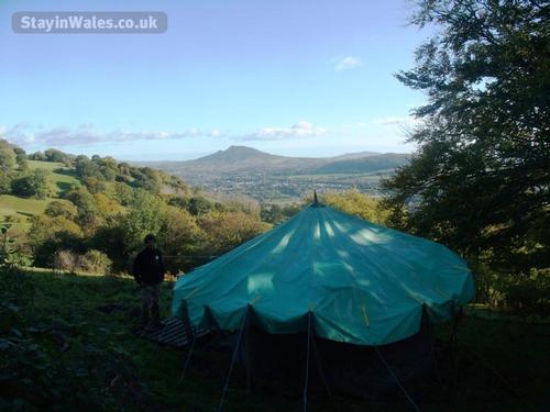 Celtic roundhouse and view of Skirrid