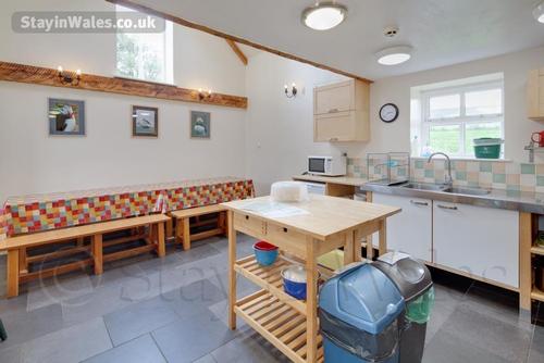 Spacious kitchen diner with big dining table seats 12 people