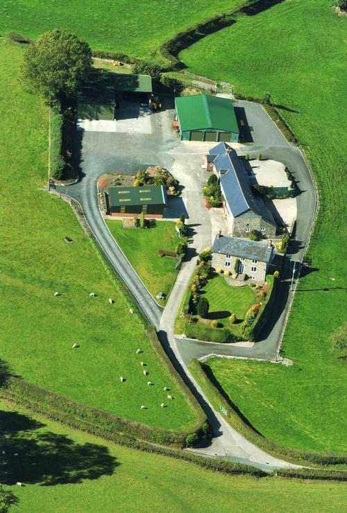 Aerial photo of Llanoddian Isaf and the cottages.