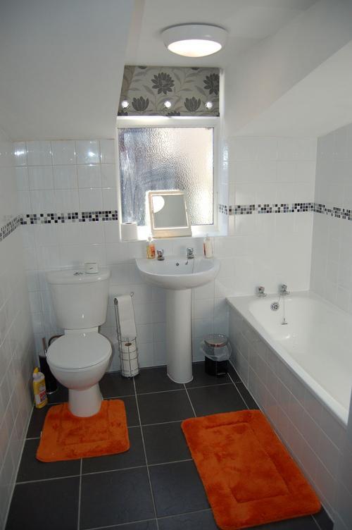 The downstairs bathroom has a free standing shower as well as a bath, and has under floor heating.