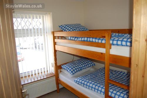 Twin Room (Bunk Beds). Bedding and towels included. Chest of Drawers. Flat screen television, DVD pl