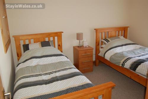 Twin Room. Bedding and towels included. Wardrobe and Chest of Drawers. Flat screen television, DVD p