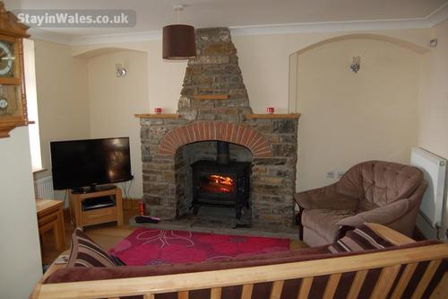 The Lounge is furnished with a comfortable 3 piece suite, nest of tables, and writing bureau. The lo