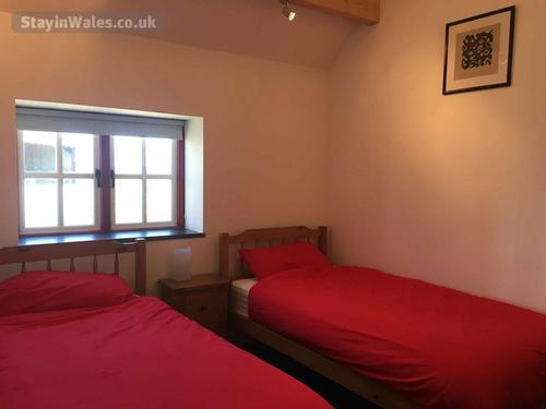 Twin bedroom with beams