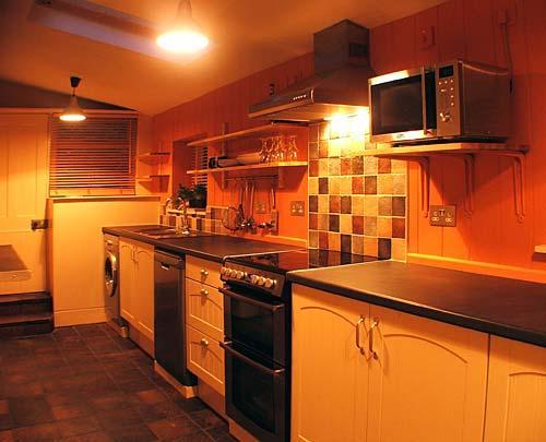 The stylish kitchen is extremely well equipped.