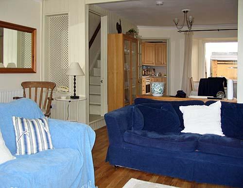 The living room with two sofas and a window seat