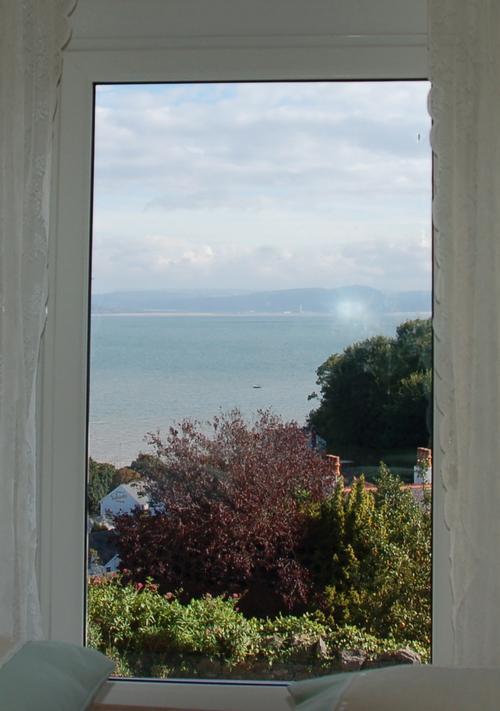 Sea view from king size four poster