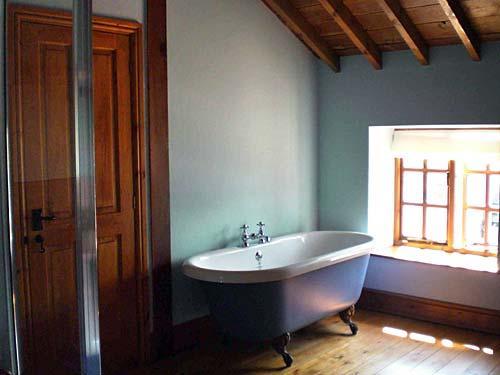 Rolltop bath in one of the en-suite bathrooms