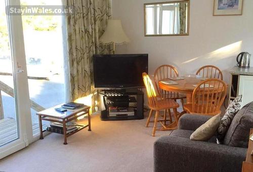 comfortable lounge with wide screen tv, digi box, DVD and video