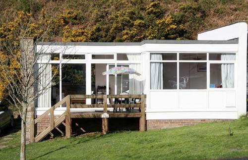 Sit in the morning sun on the balcony of Fulmar Chalet