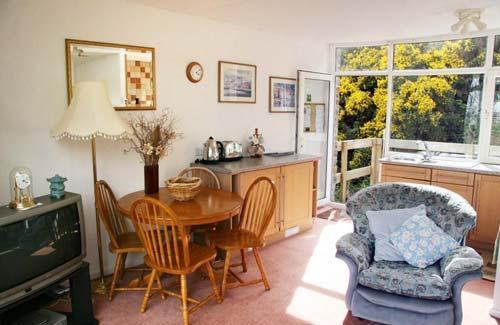 Dining area looking out to back balcony