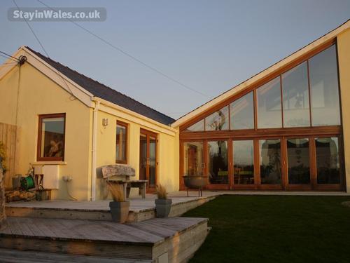 Sunset at Hen BeudyHen Beudy is the annexe to Parcmaenllwyd Farmhouse, is surrounded by fields and h
