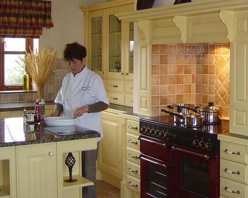 Ceinwen preparing dinner in the farmhouse kitchen