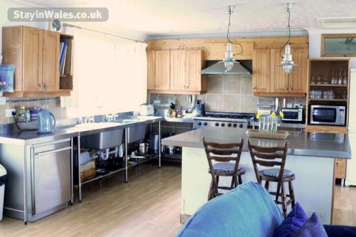 Open plan Kitchen with Island prep area all in Stainless Steel