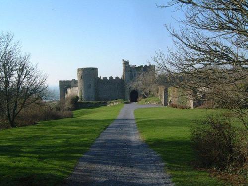 A walk to the castle and cafe in the village with Manorbier bay in the background