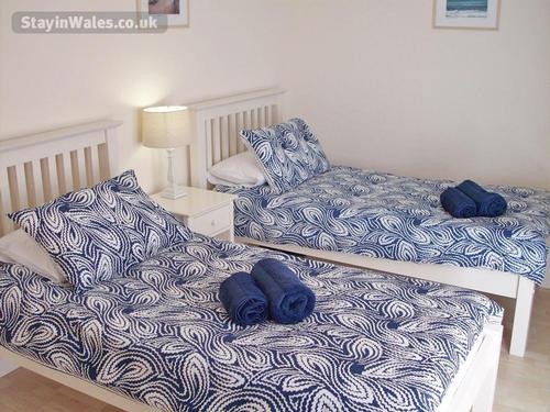 Ground floor twin bedroom with French windows to patio.