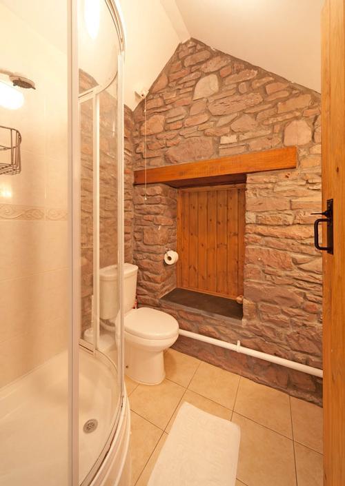 En-suite shower room with wash basin and loo