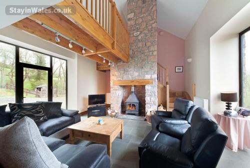 The comfortable living area has a woodburner and freesat tv