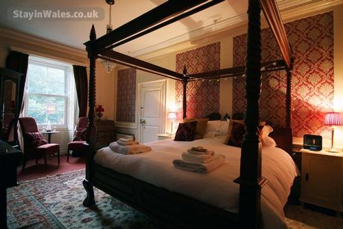 The sumptuous Red Room has a luxurious four poster bed with a large en-suite bathroom with separate