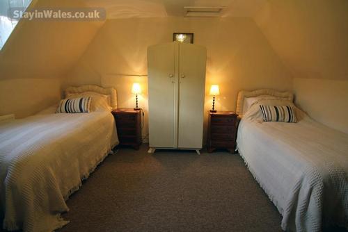 Top floor with a shared shower room. This room can have an extra bed if required.
