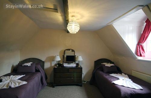 Twin room with a shared shower room. These beds can be made up as a supersize bed if with notice.