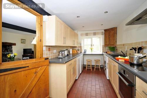 Kitchen with breakfast bar and stools