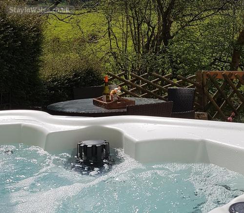 Hot tub overlooking open fields