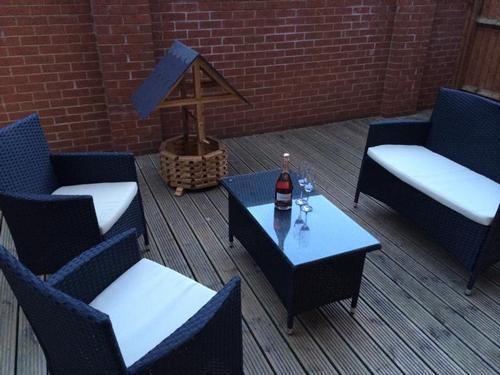 Decked yard area with outdoor furniture