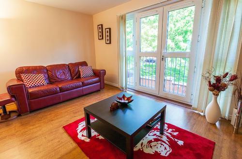 Living room with French doors overlooking the park