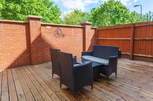 Decked sitting area with outdoor furniture
