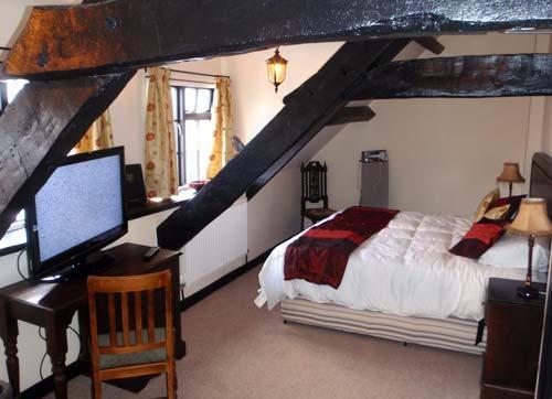 One of our beamed guest bedrooms