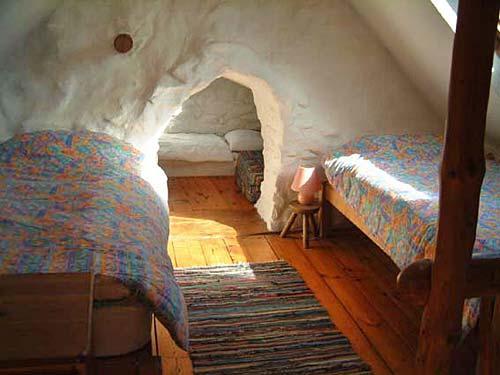 Galleried bedroom and further cave bedroom in Converted Cowshed.
