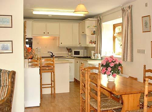 Kitchen and dining area at white House cottage
