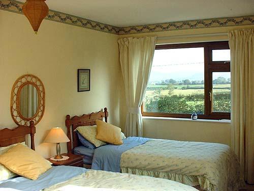 Twin bedroom at White House Cottage