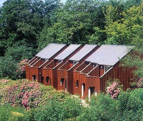 Woodland lodges - balconies have view across National Parkland and Carmarthen Bay beyond.