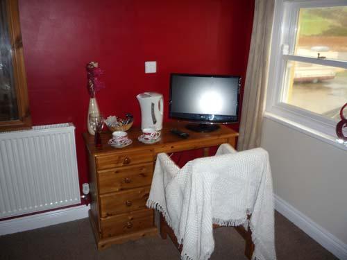 20'' Flat screen tv in each room with facilities for tea, coffee, hot chocolate and fruit tea.