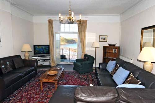 Dewi Emrys flat (sleeps max. 7) large living room with an outside balcony overlooking Tenby harbour.