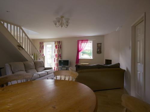 Guest lounge with television , log burning stove and tea making facilities