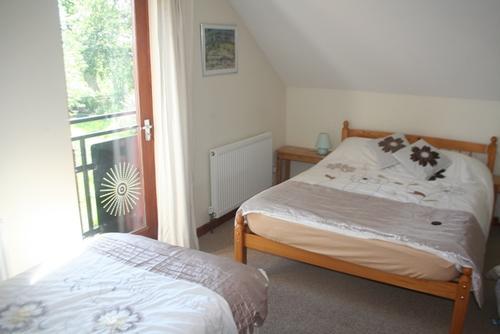 The Loft''s bedroom, stunning views from both Juliette balconies.
