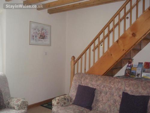Staircase leading to the three bedrooms and bathroom