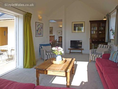 Living room with French doors opening onto the patio area
